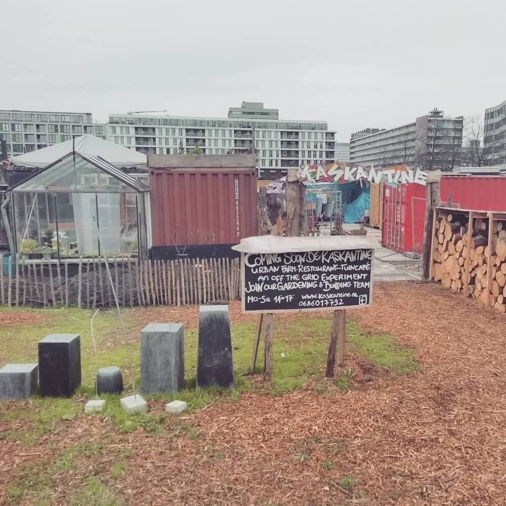 A sign for 'Kaskantine', a community garden and restaurant project, coming soon.