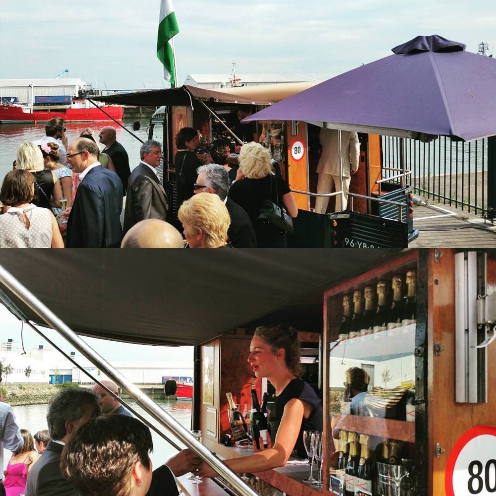 A collage of wedding guests gathered on a boat under a purple umbrella, and a woman serving drinks from a bar cart.