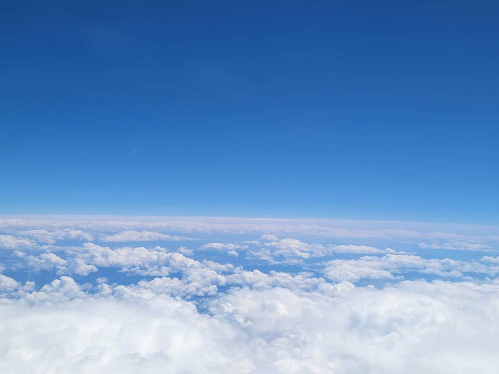 blue sky above white clouds