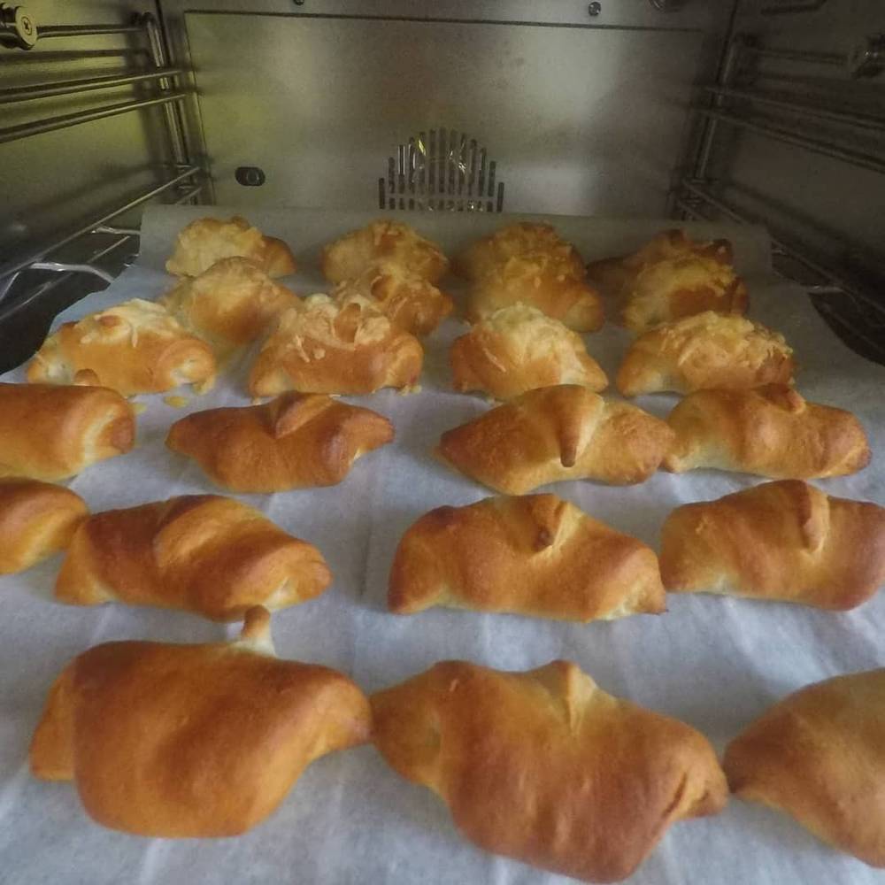 A tray of freshly baked croissants.