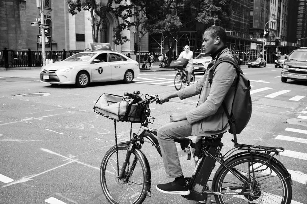 Urban Delivery Cyclist Navigates NoMad Streets