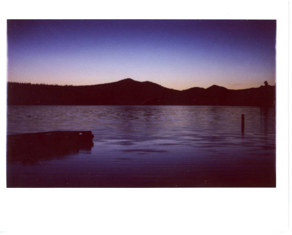 Lava Lake at dusk. Purple hues in the sky reflected on the lake with just a hint of orange near the horizon
