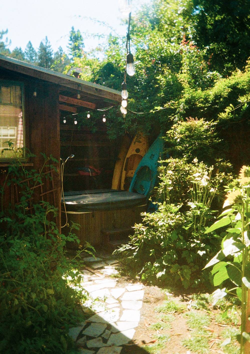 Canoe behind jacuzzi.