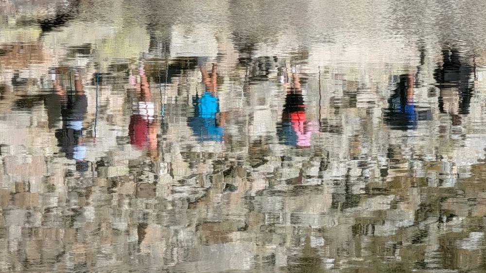 Hikers beside a lake