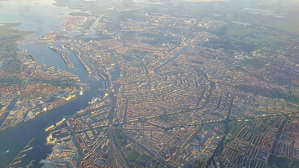 Aerial view of a coastal town's canals and harbor.