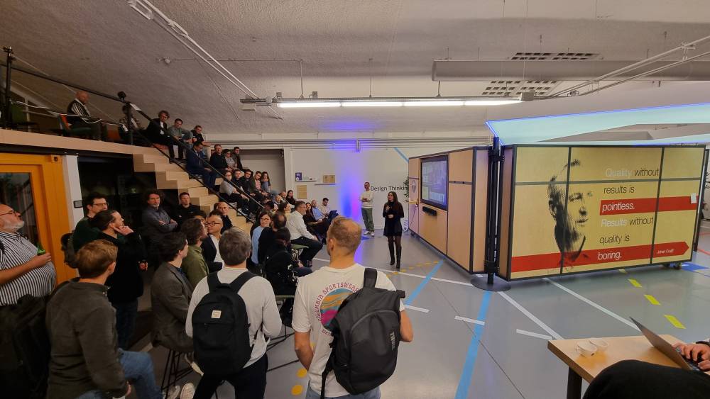 Group of people watching a presentation 