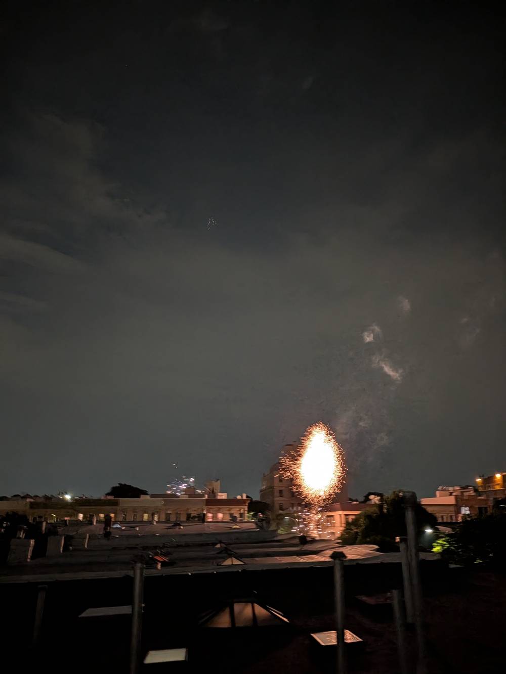 Fireworks off in the distance from the roof