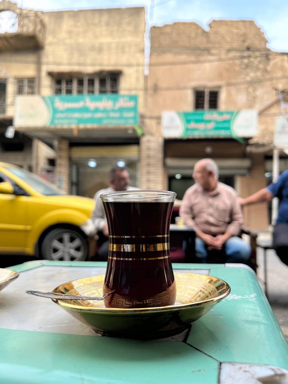 Tea on a stool. Umm Kulthum on the radio.