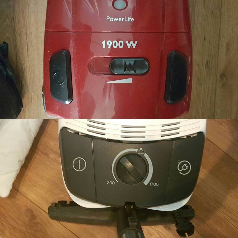 Close-up of the dials and switches on a red vacuum cleaner and a fan heater.