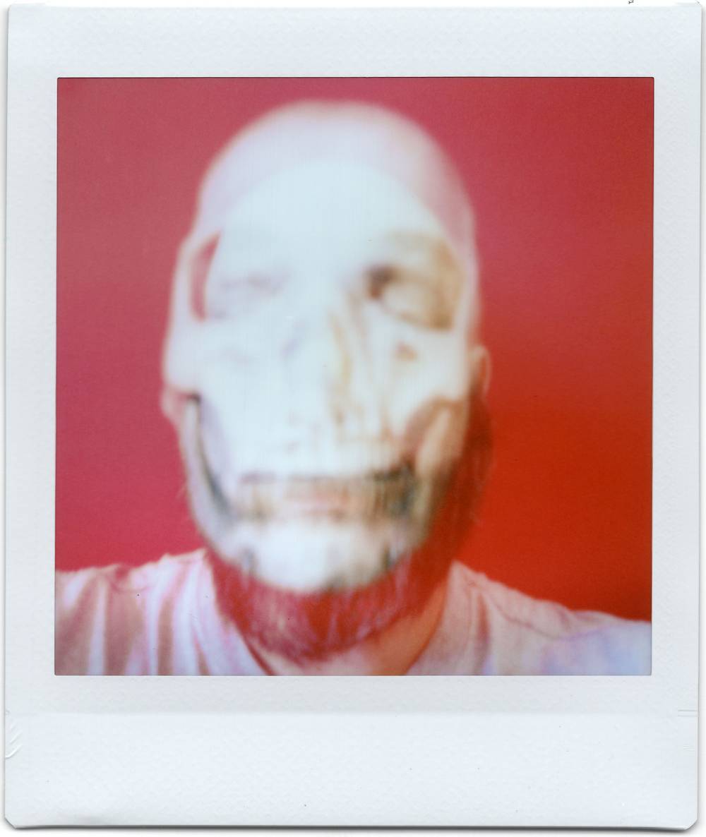 double exposure fuji instax print - skull superimposed on me, a halloween self portrait