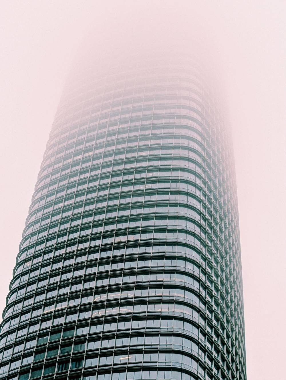 skyscraper disappearing into fog