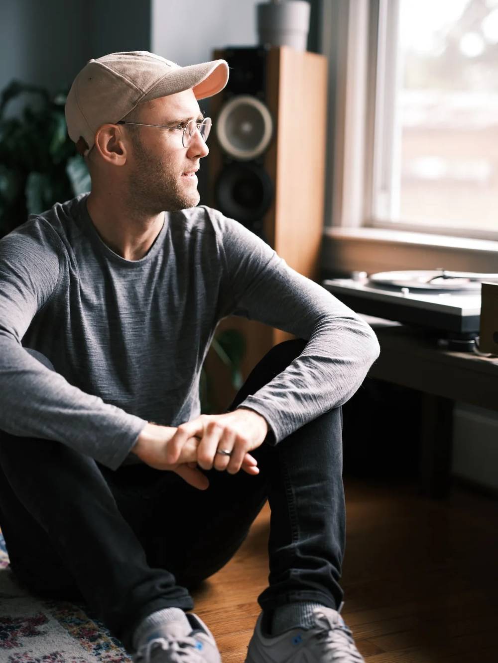 Man Sitting Thoughtfully by Window in Portland Home