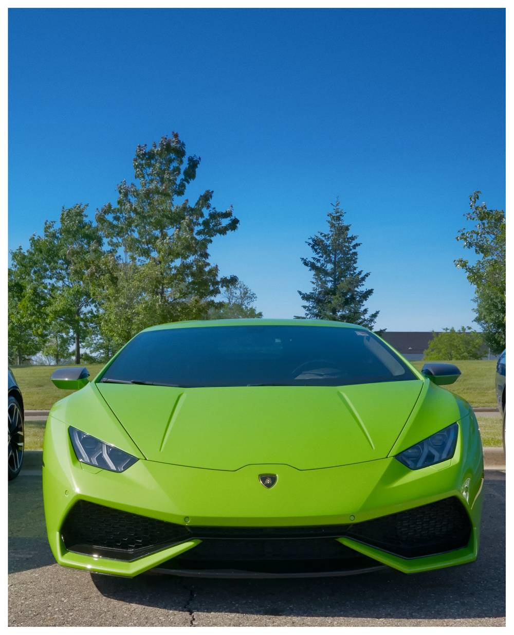 Front view of a lime green Lamborghini Huracan