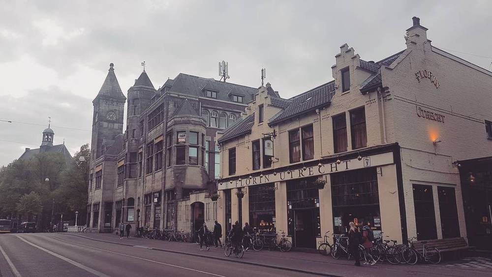 A historic ornate building on an empty street in Utrecht.
