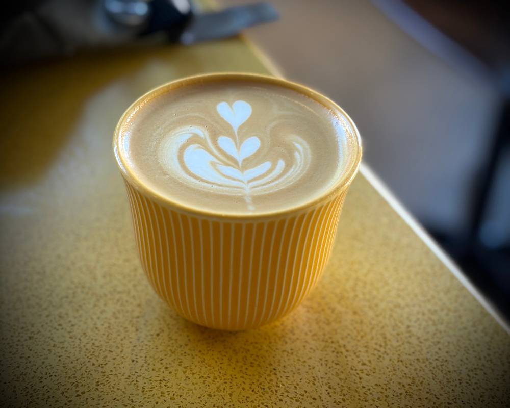 Cappuccino in a cute handle-less mug