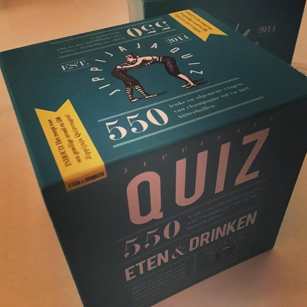 A quiz game box titled "550 Eten & Drinken" (Food & Drink) on a table.