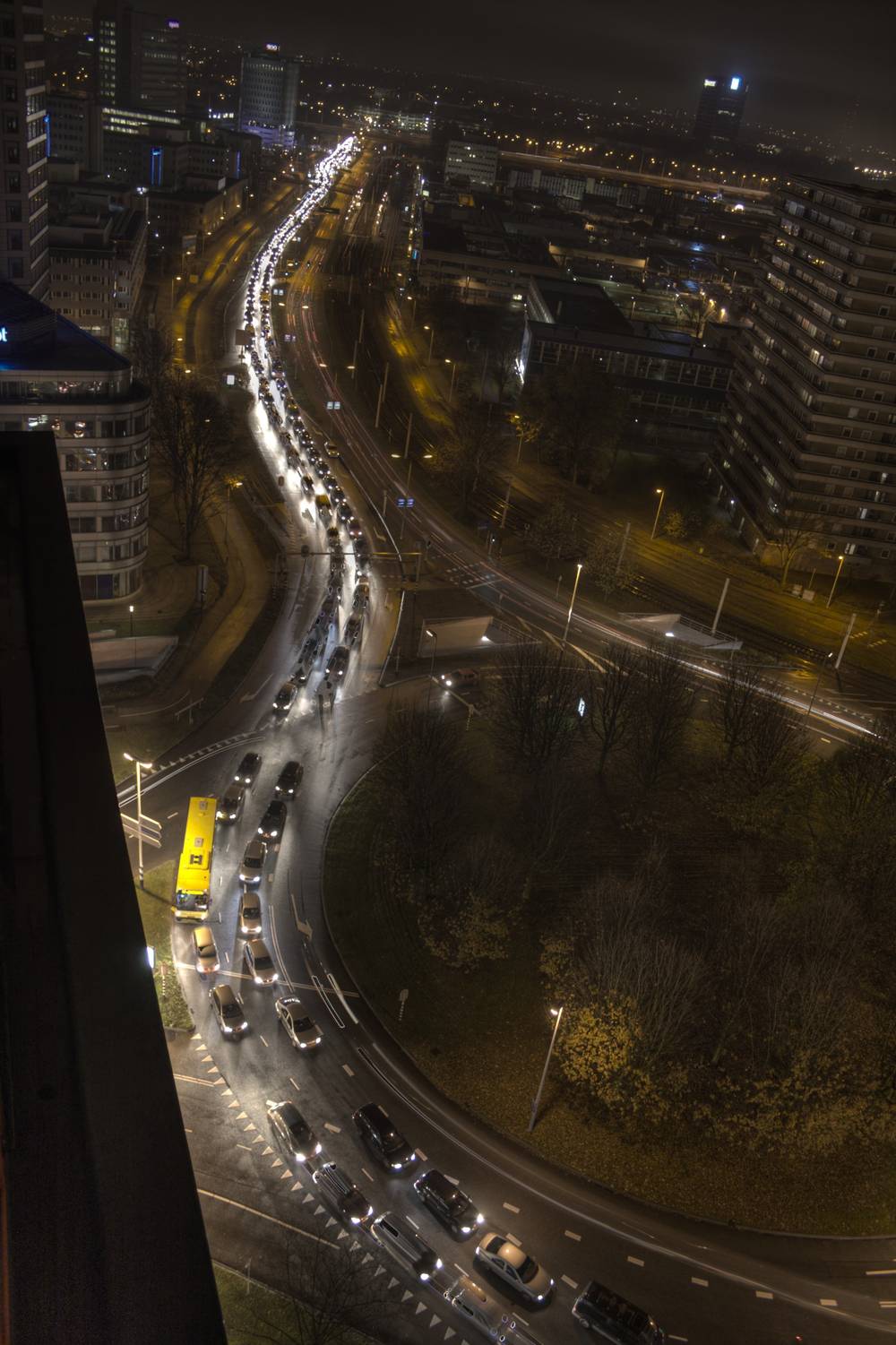 Traffic backs up on a road at night, caused by crowds heading to an Armin van Buuren concert.