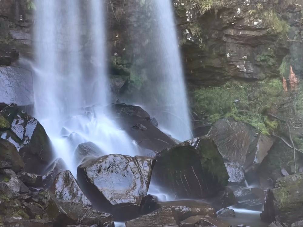 Long exposure of the base of largest waterfall at Melincourt hitting the rocks at the bottom of the