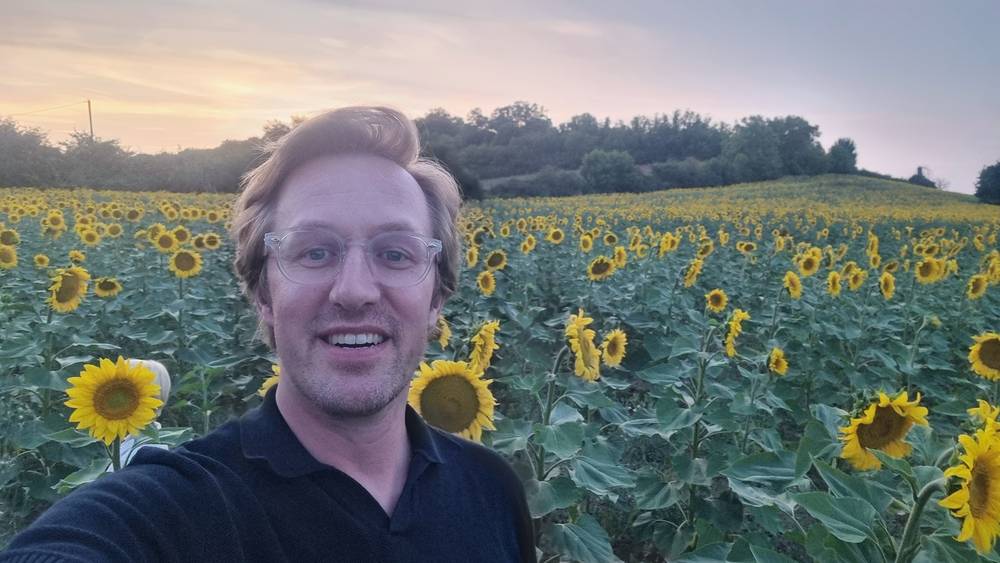 Guido in a field of sunflowers