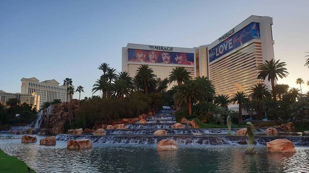 The Mirage hotel and its volcano water feature at dusk in Las Vegas.