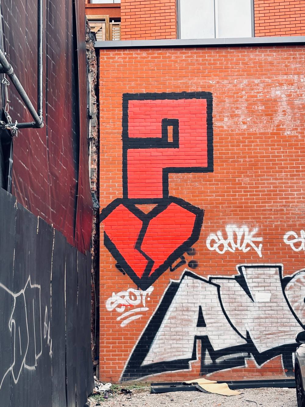 A big red question mark with a broken heart - graffiti
