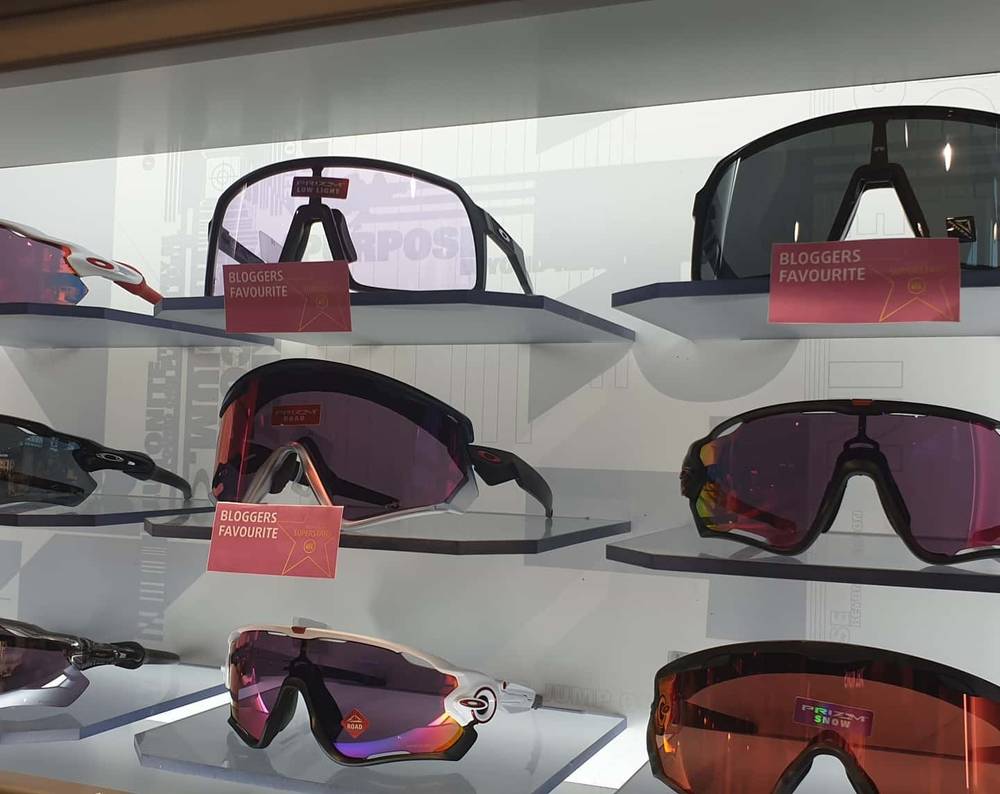 A display of sports sunglasses on a rack tagged "Bloggers Favourite".