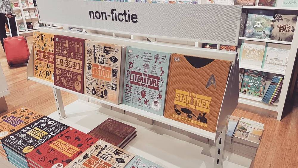 A bookshop's non-fiction display table, with books on philosophy, history and pop culture.