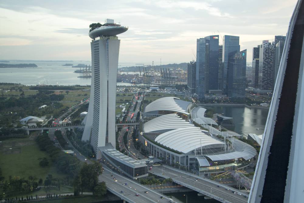 An aerial view of Marina Bay Sands' tower and the domed convention centre below.