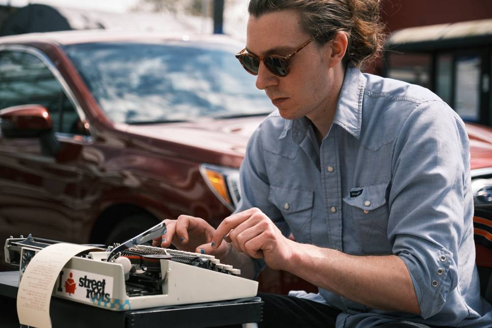 Street Poet Crafting Words on Alberta