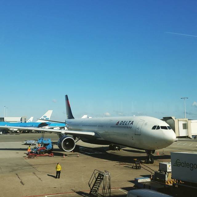 A Delta Air Lines passenger jet parked at an airport gate.