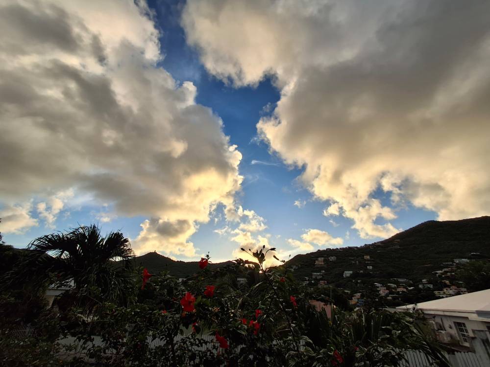 clouds in a dramatic sky above caribbean hill tops