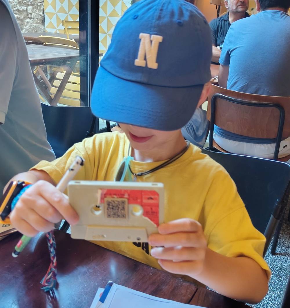 Guido's kid with a cassette tape