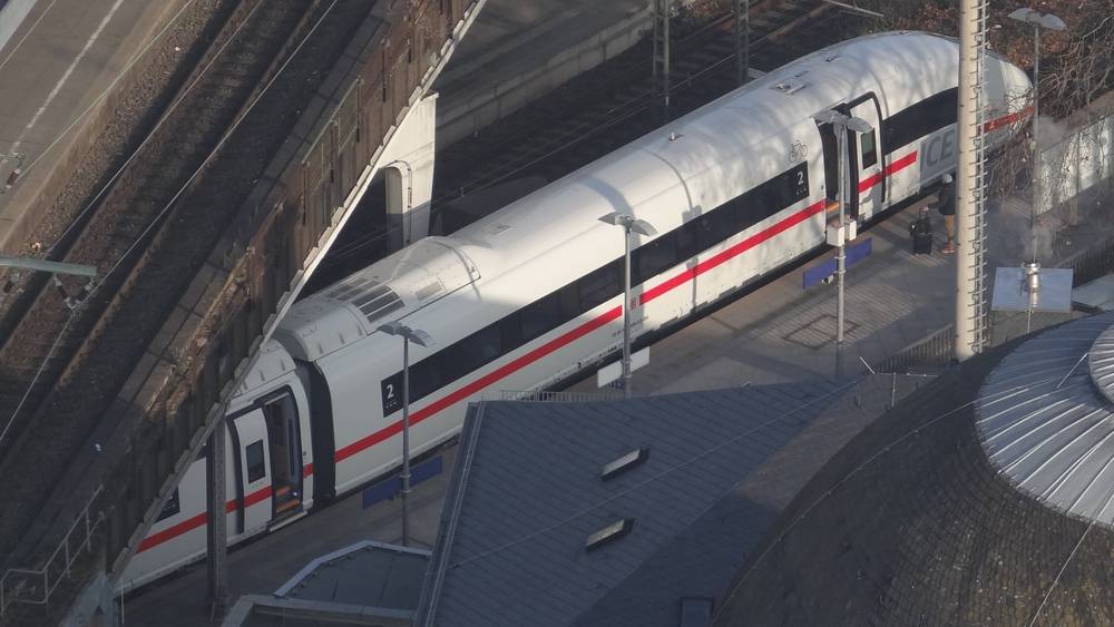 ICE (high speed train operated by Deutsche Bahn) waiting at a platform at the train station in Deutz.