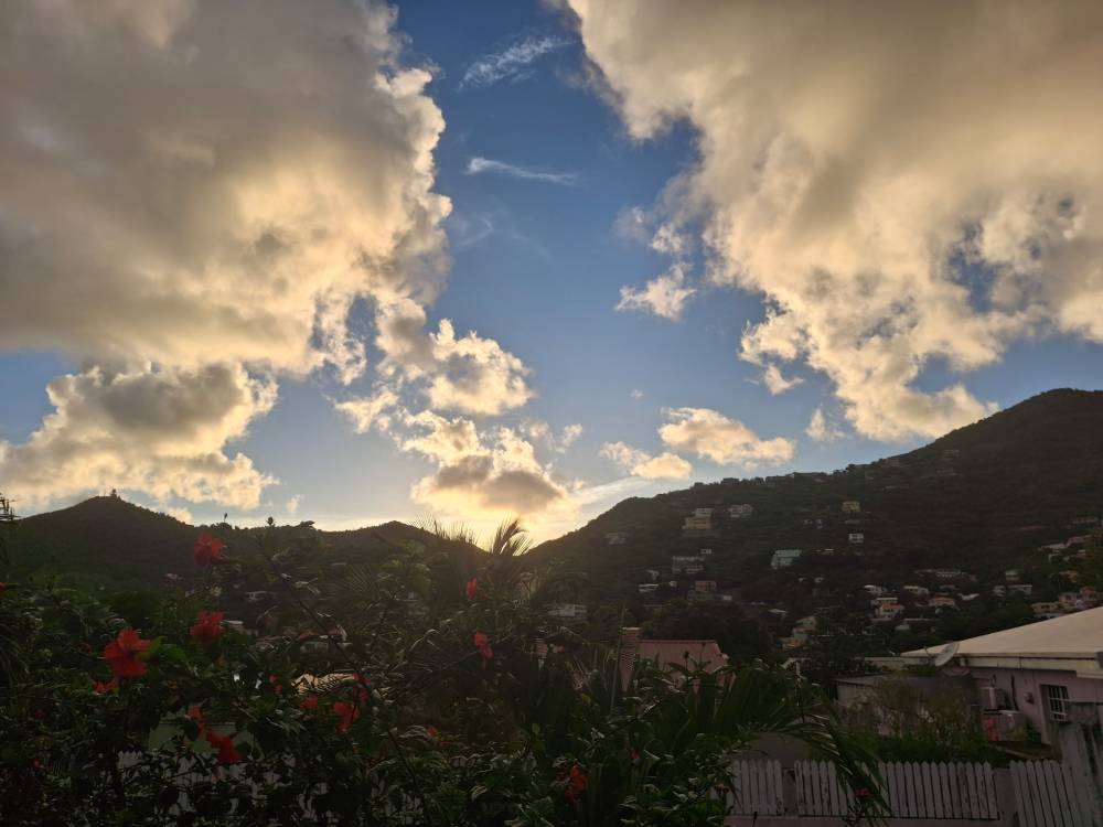 clouds in a dramatic sky above caribbean hill tops