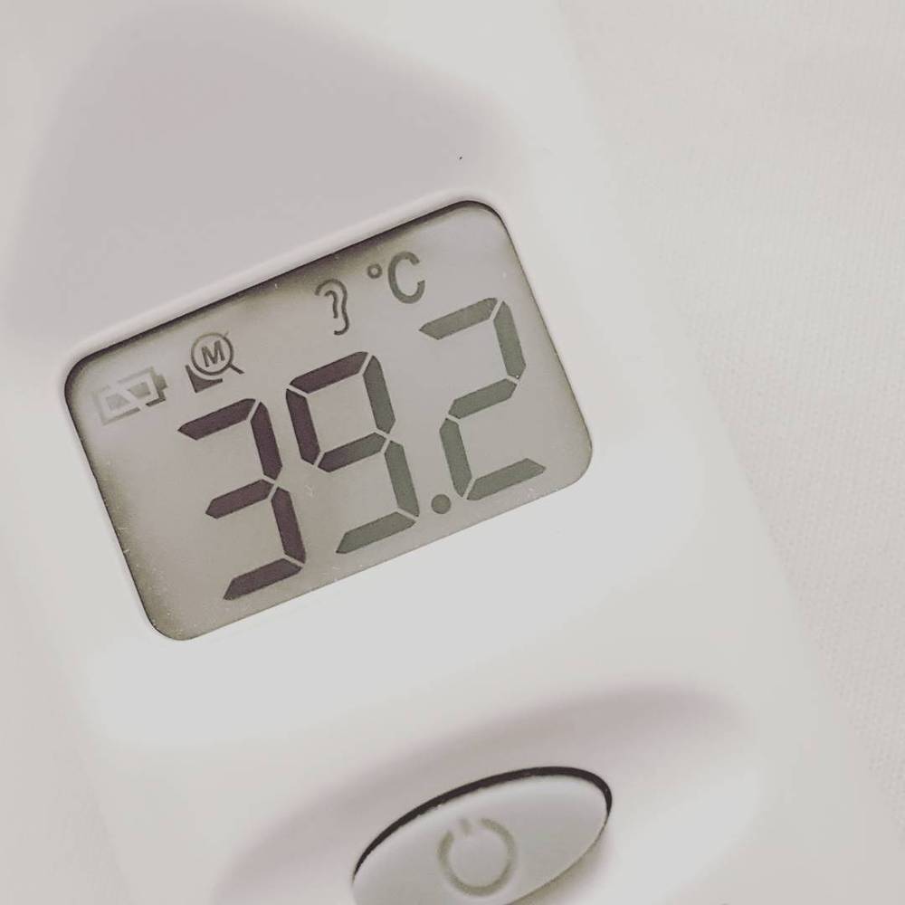 A digital thermometer display showing a temperature reading of 39.2 degrees Celsius.