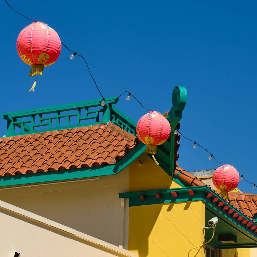 red paper lanterns outside a chinese cultural center in oakland chinatown