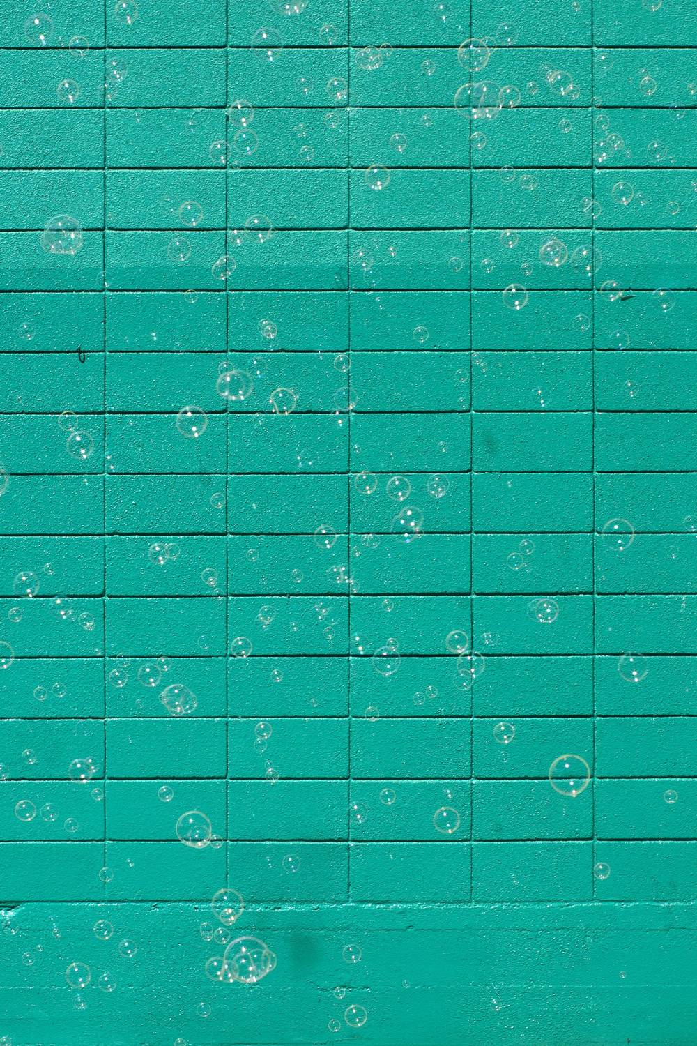 bubbles against a green wall