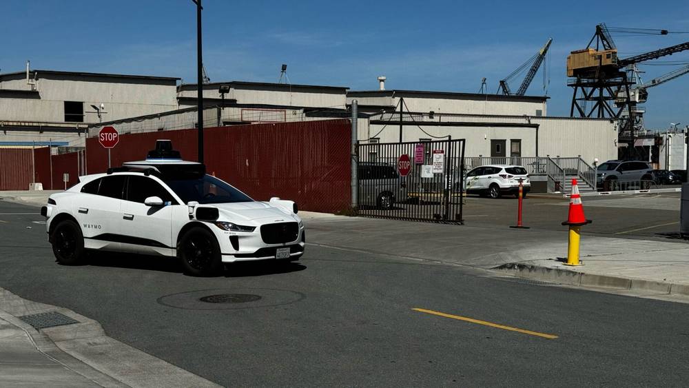 this self driving car had a long standoff with a traffic cone on the side of the road. then the c…