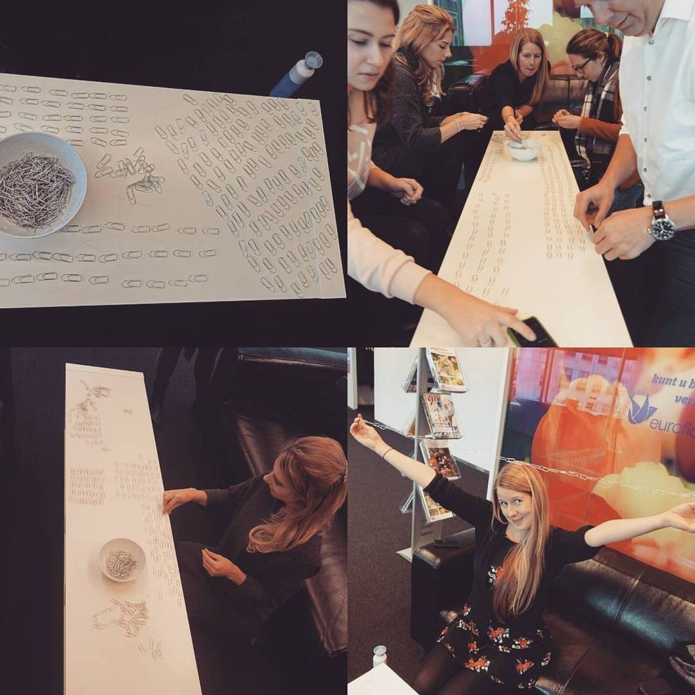 Collage of people gathered around a table drawing on a long paper scroll during a workshop.