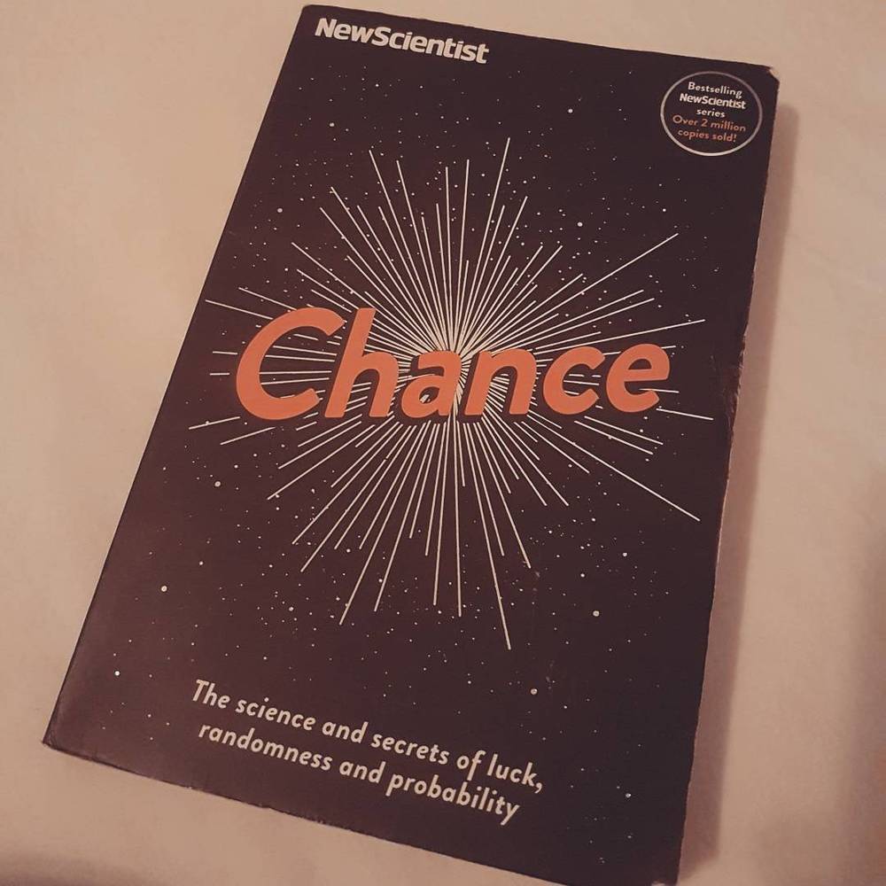 A New Scientist magazine cover on a table.