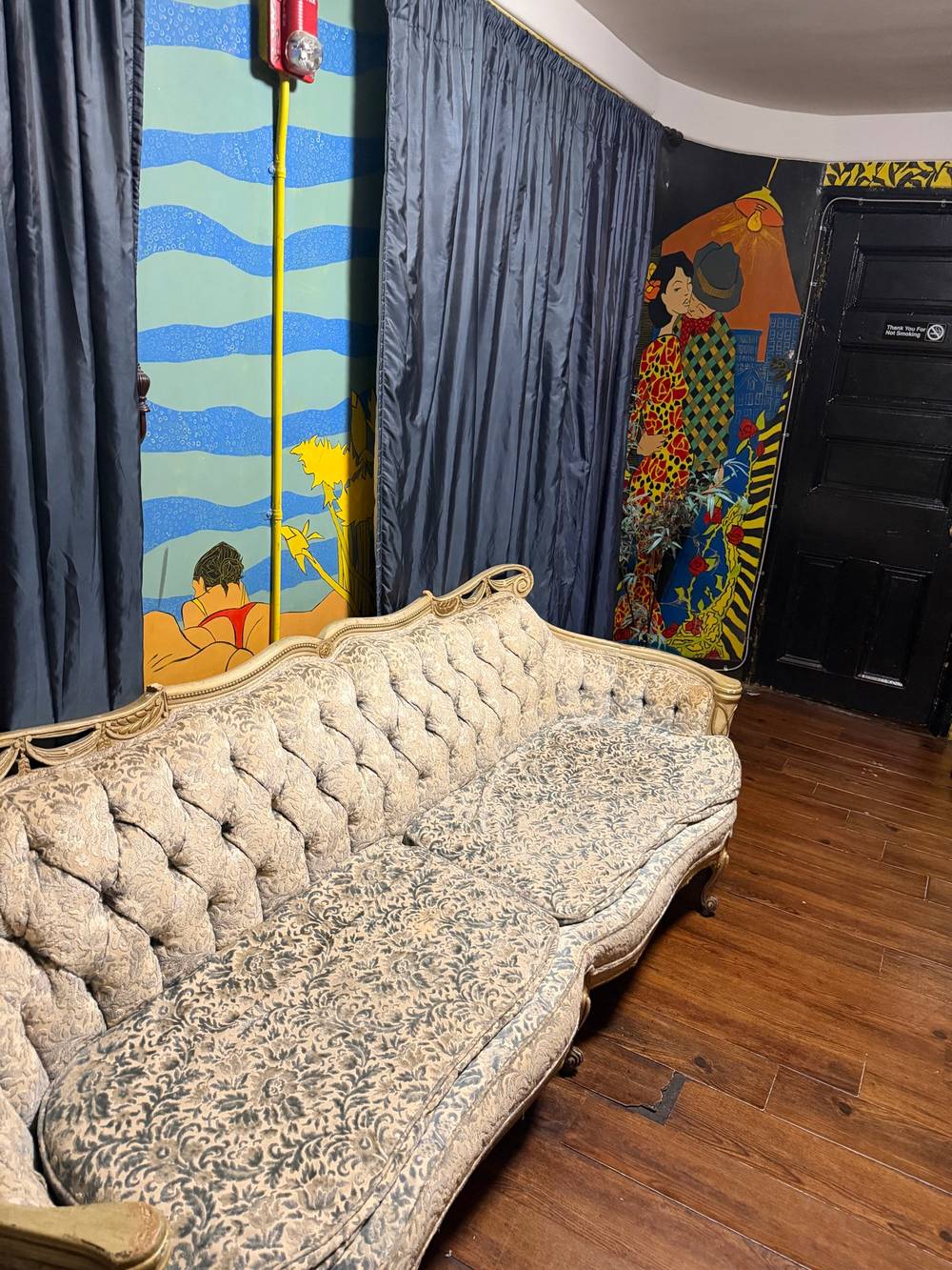 Couch in a cocktail bar bathroom for some reason 