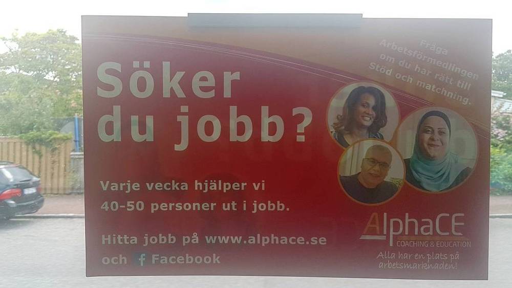 A Swedish street billboard advertising job-search help, reading "Söker du jobb?" ("Looking for a job?") for AlphaCE coaching.
