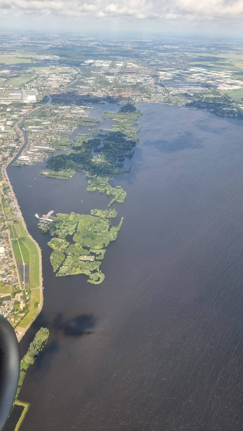 Aerial view of a lake and river delta landscape.