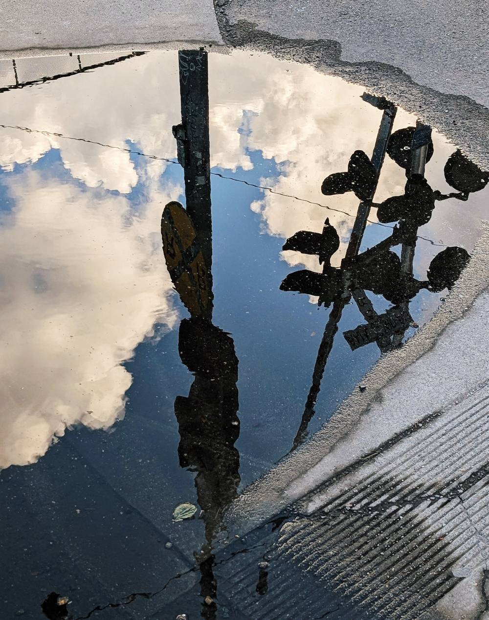 Reflection of the sky in a puddle