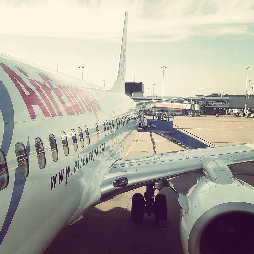 An Air Europa passenger plane parked at an airport gate.