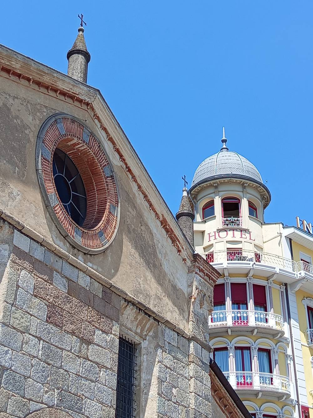 The "Chiesa di Santa Maria degli Angioli" meets the "International au Lac Historic Lakeside Hotel"
