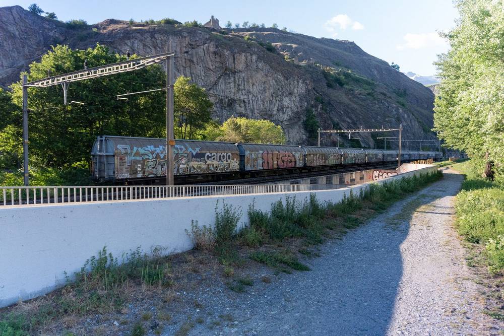 Stopped SBB Cargo train cars  in Sion, above the underpass
