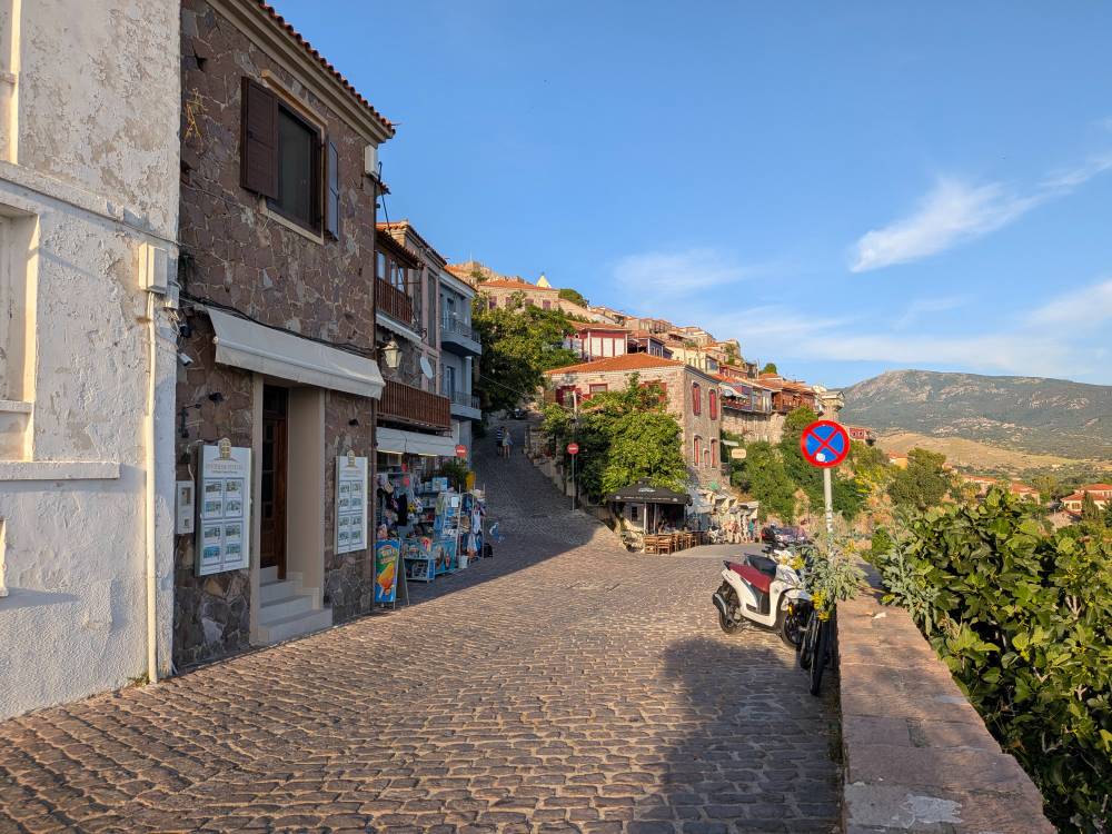 The cobblestone street of a Greek island city 