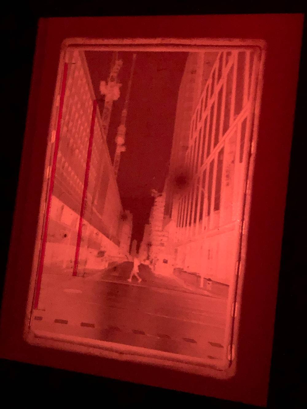 The previous image in negative, projected on the baseboard of an easel in a darkroom