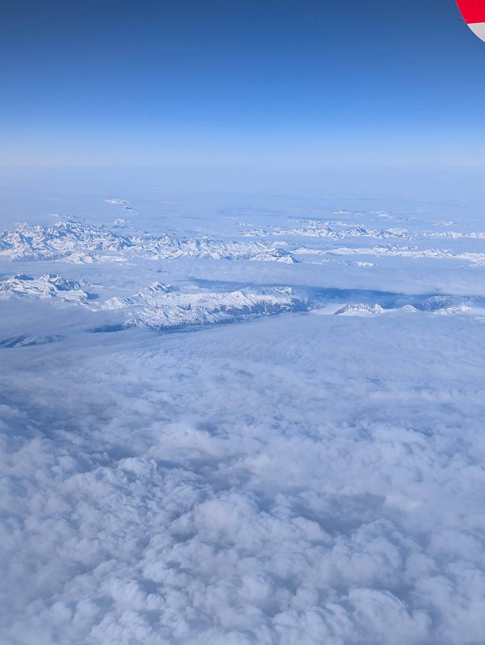 Top down view from an aeroplane over clouds